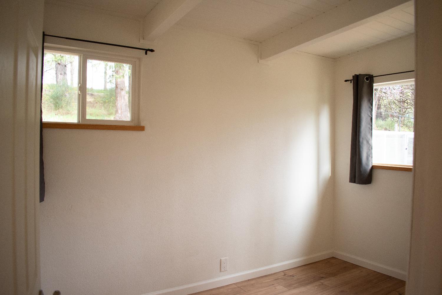 4881 Marshall Road Garden Valley, CA 95633 - Photo 18 of 25 an empty room with windows