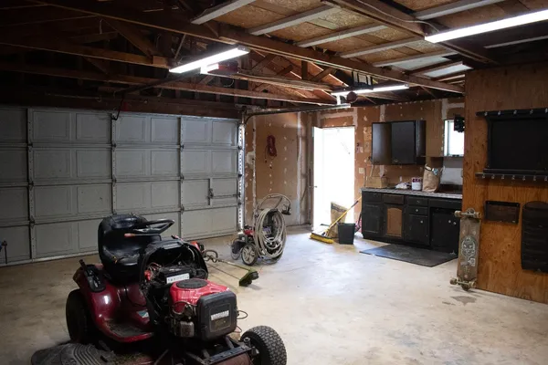 a view of a garage with storage and utility