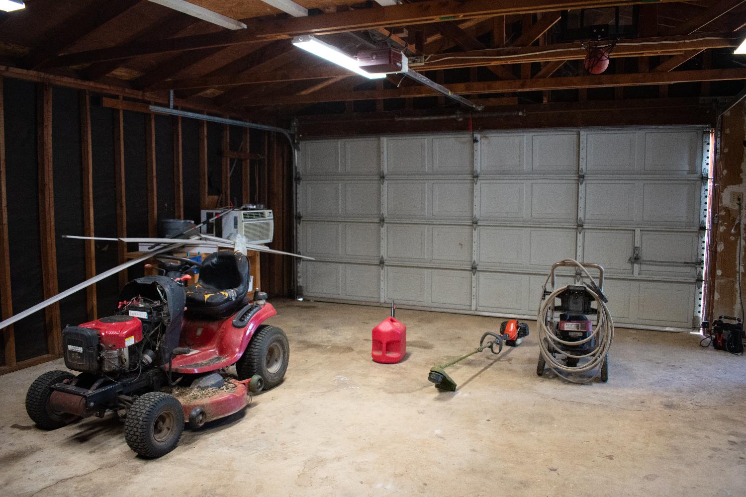 4881 Marshall Road Garden Valley, CA 95633 - Photo 7 of 25 a view of a garage with storage and utility