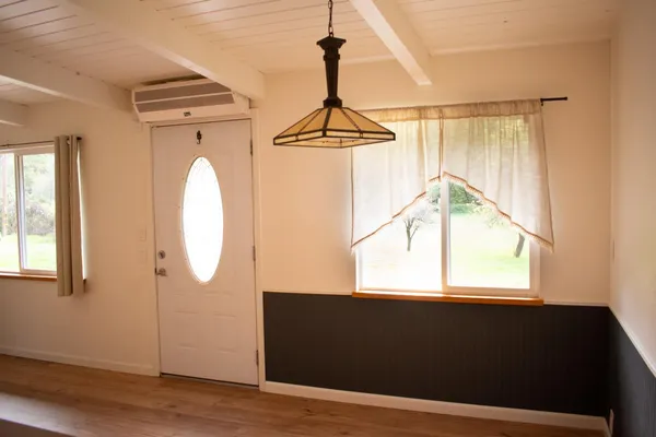 a view of kitchen and hallway with wooden floor