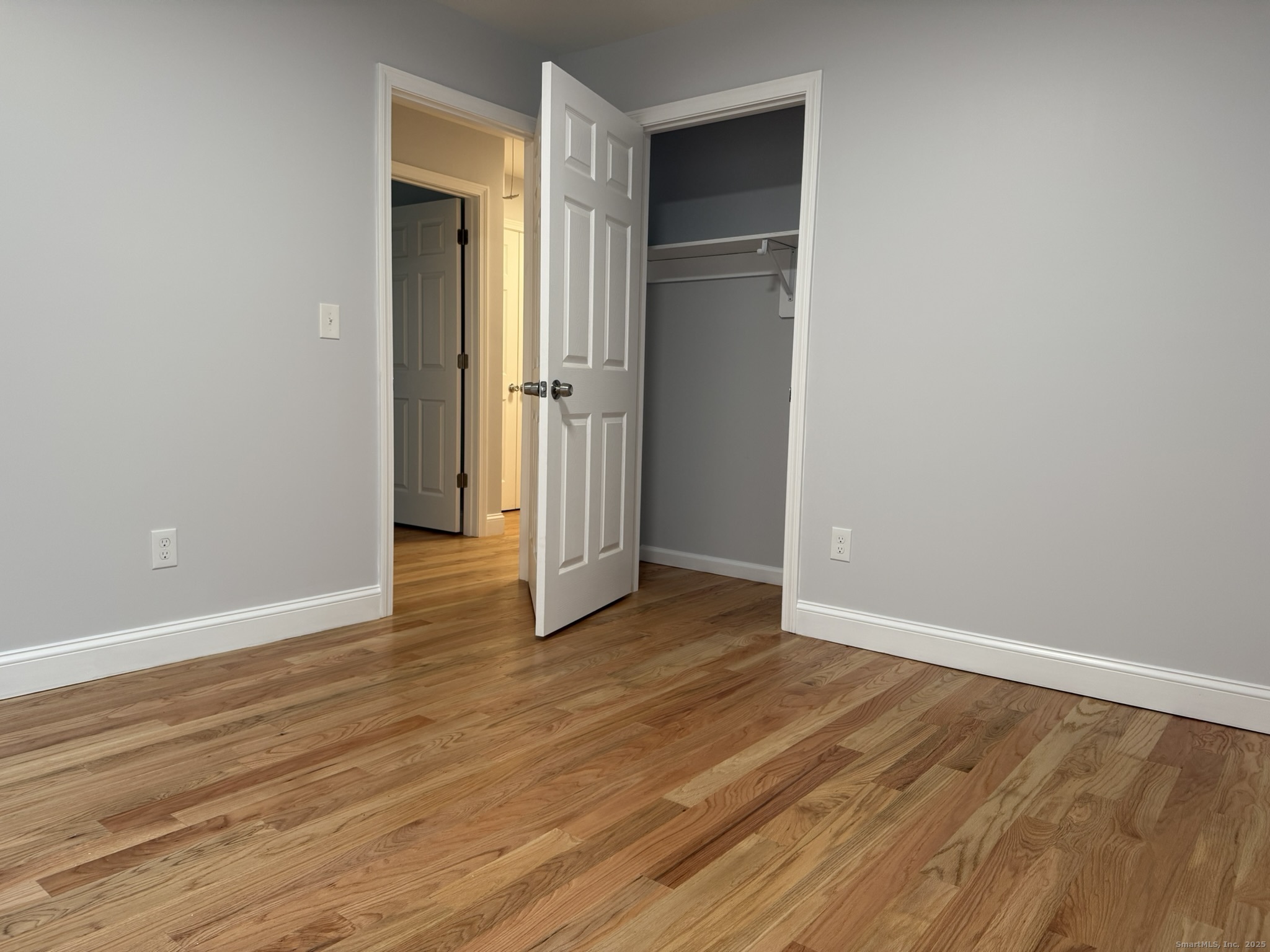 755 Hart Street Bridgeport, CT 06606 - Photo 12 of 37 an empty room with wooden floor & closet area