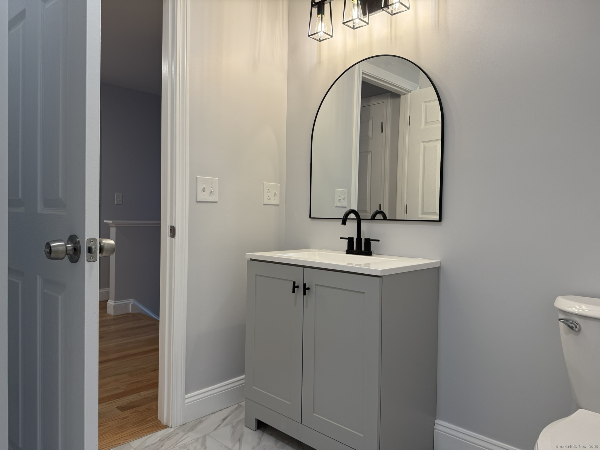 755 Hart Street Bridgeport, CT 06606 - Photo 2 of 37 a bathroom with a sink a toilet and shower