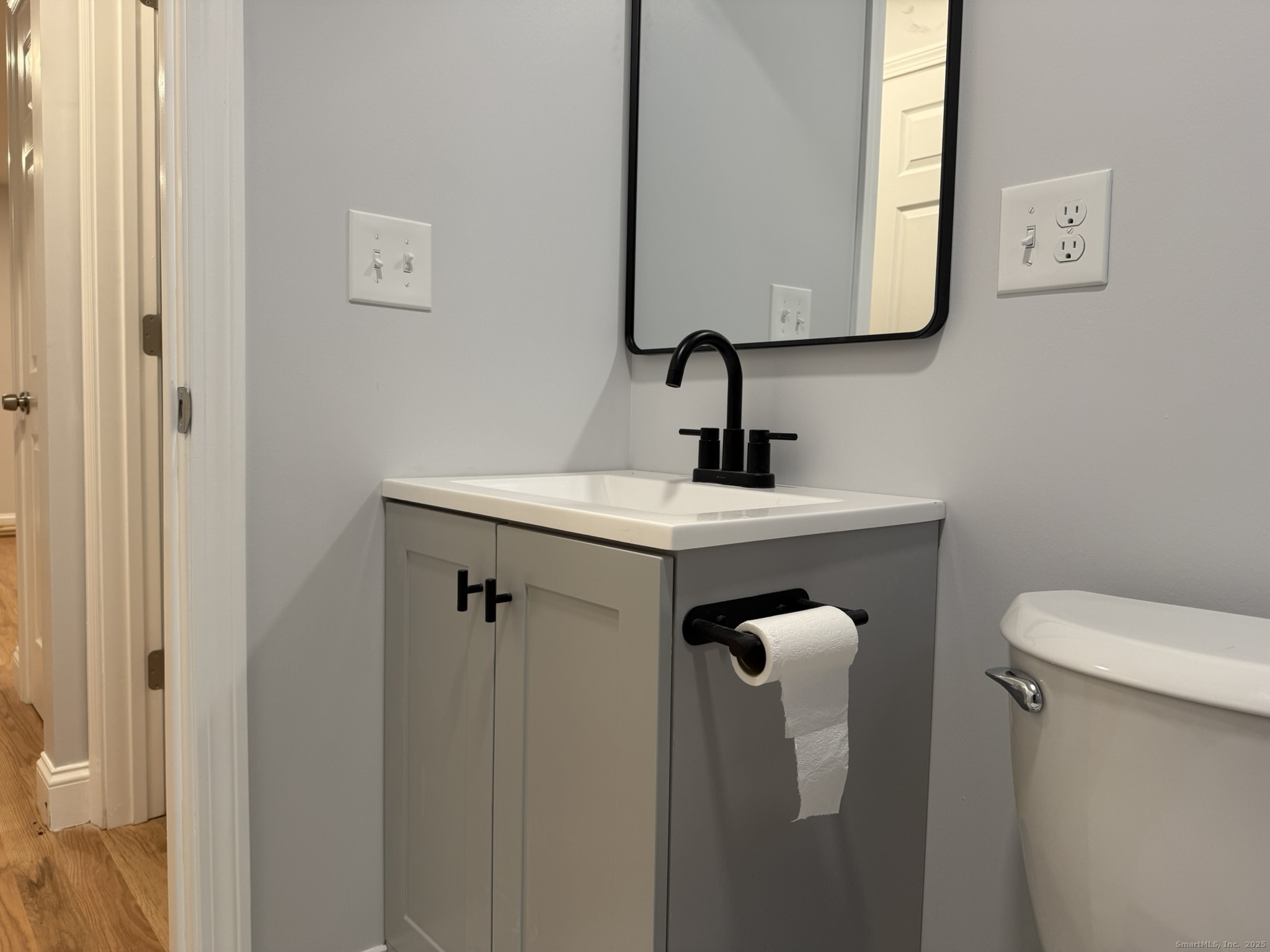 755 Hart Street Bridgeport, CT 06606 - Photo 21 of 37 a bathroom with a sink a toilet and mirror