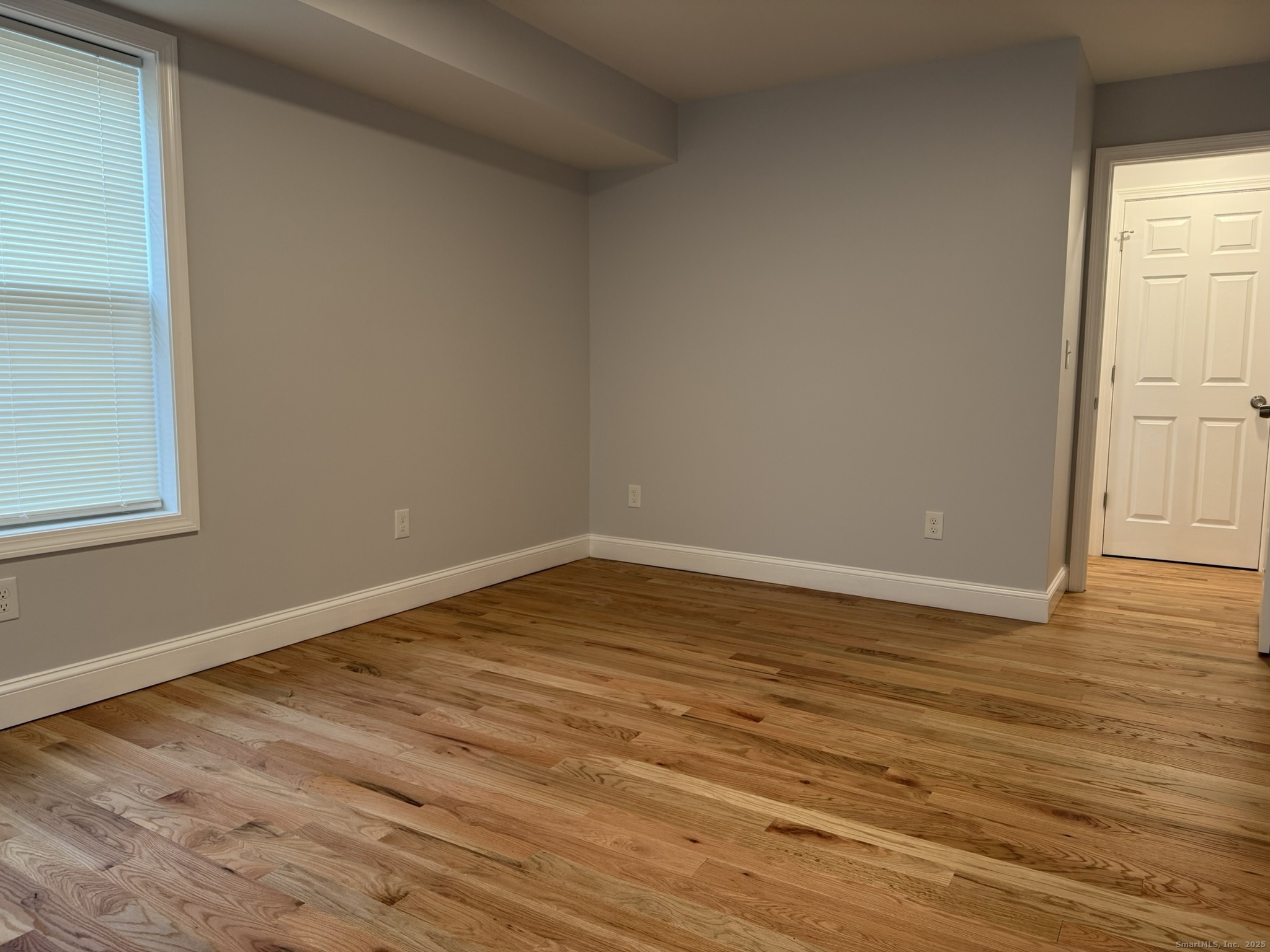 755 Hart Street Bridgeport, CT 06606 - Photo 23 of 37 a view of empty room with wooden floor and fan