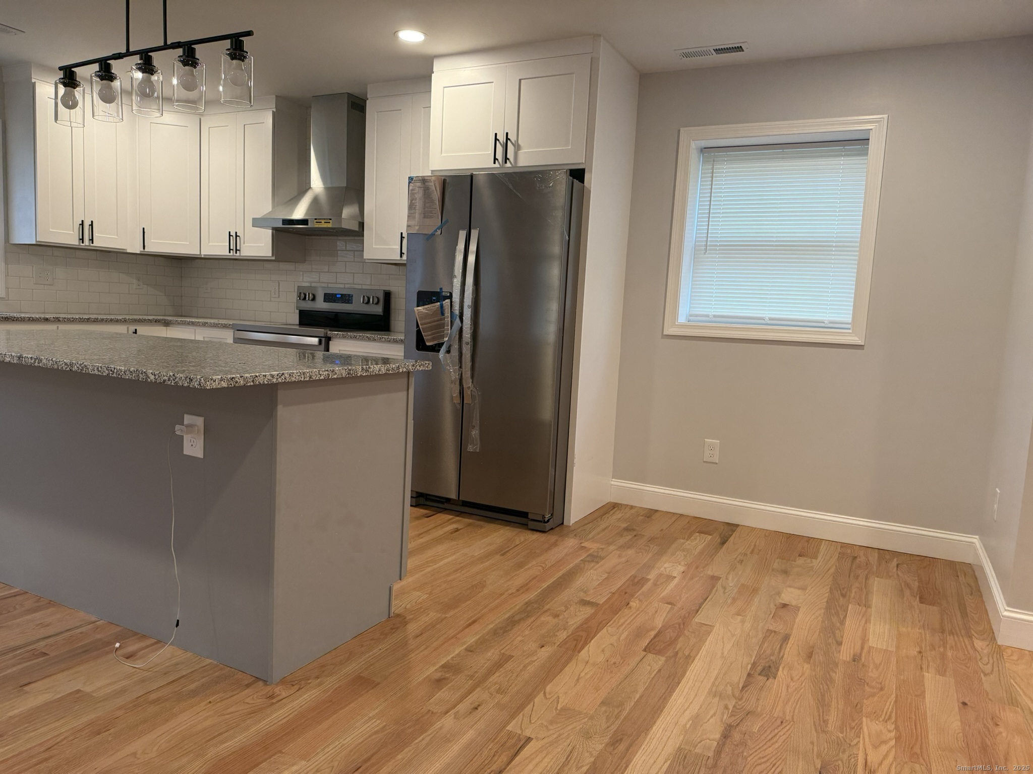 755 Hart Street Bridgeport, CT 06606 - Photo 28 of 37 a kitchen with stainless steel appliances granite countertop a refrigerator sink and stove
