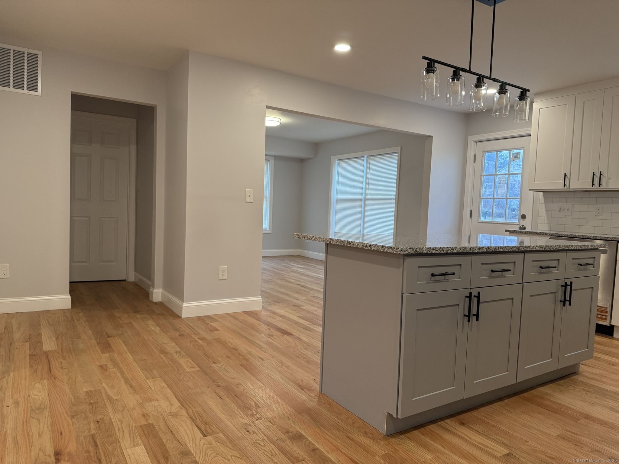 755 Hart Street Bridgeport, CT 06606 - Photo 32 of 37 a kitchen with stainless steel appliances granite countertop a refrigerator and a sink