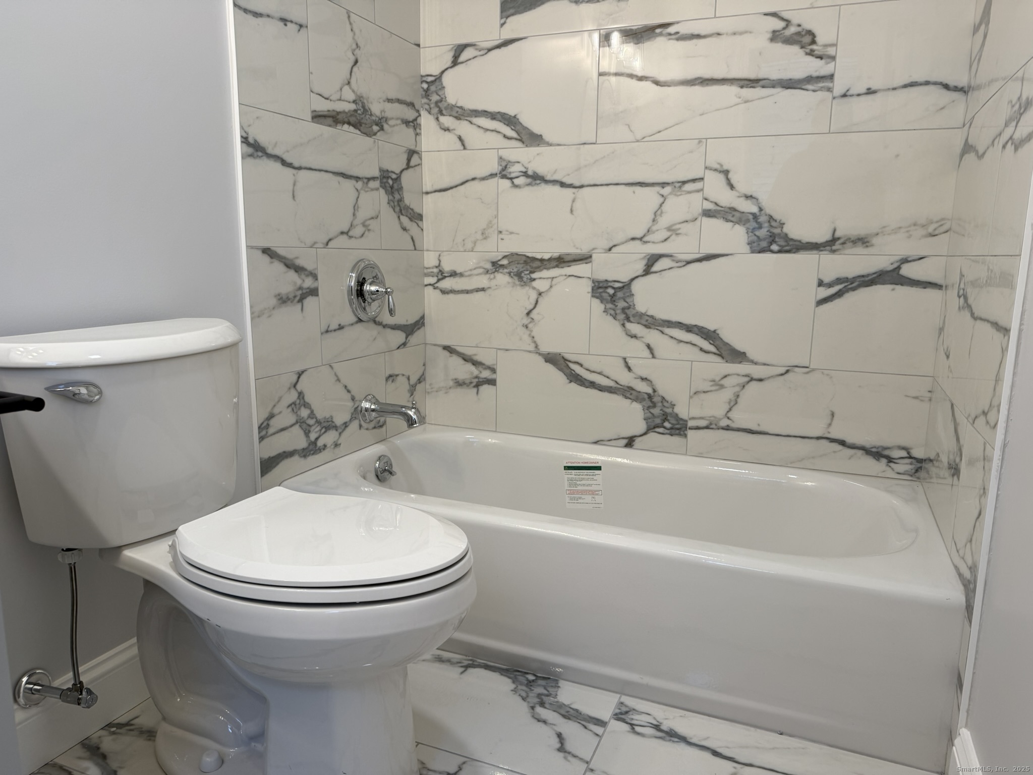 755 Hart Street Bridgeport, CT 06606 - Photo 6 of 37 a bathroom with a toilet and a bathtub