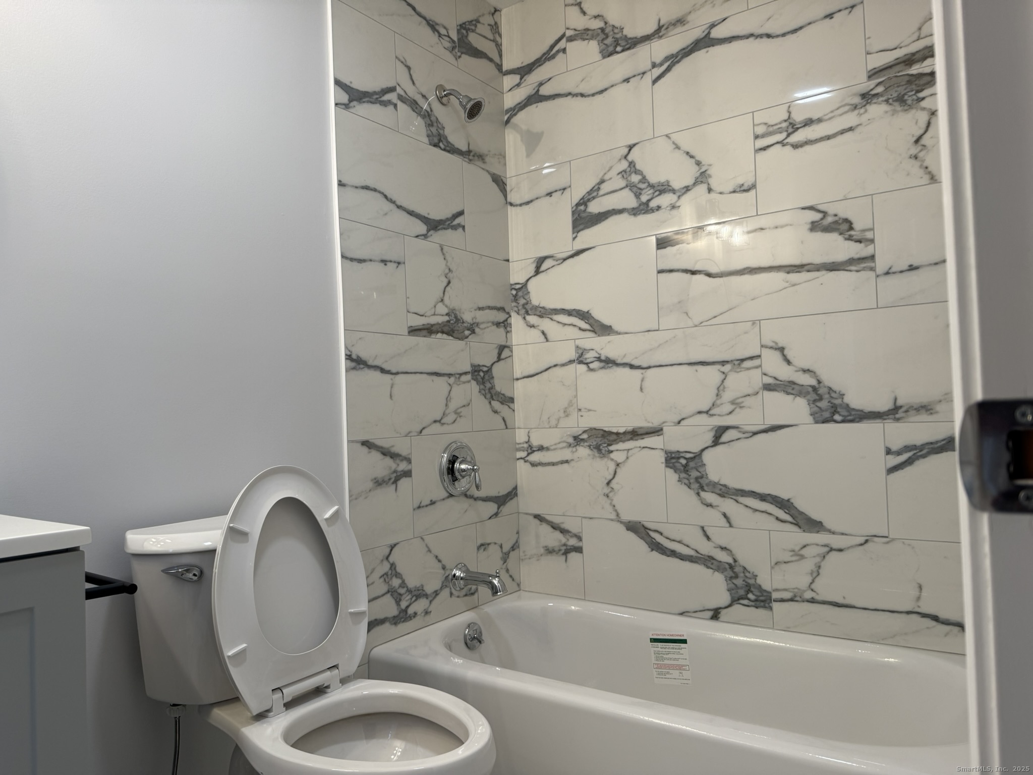 755 Hart Street Bridgeport, CT 06606 - Photo 7 of 37 a bathroom with a sink a toilet and shower