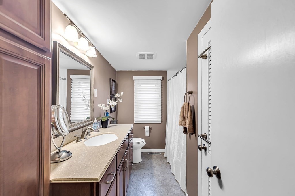 60 Intervale Road Springfield, MA 01118 - Photo 15 of 29 a en suite bathroom with a granite countertop sink and a mirror