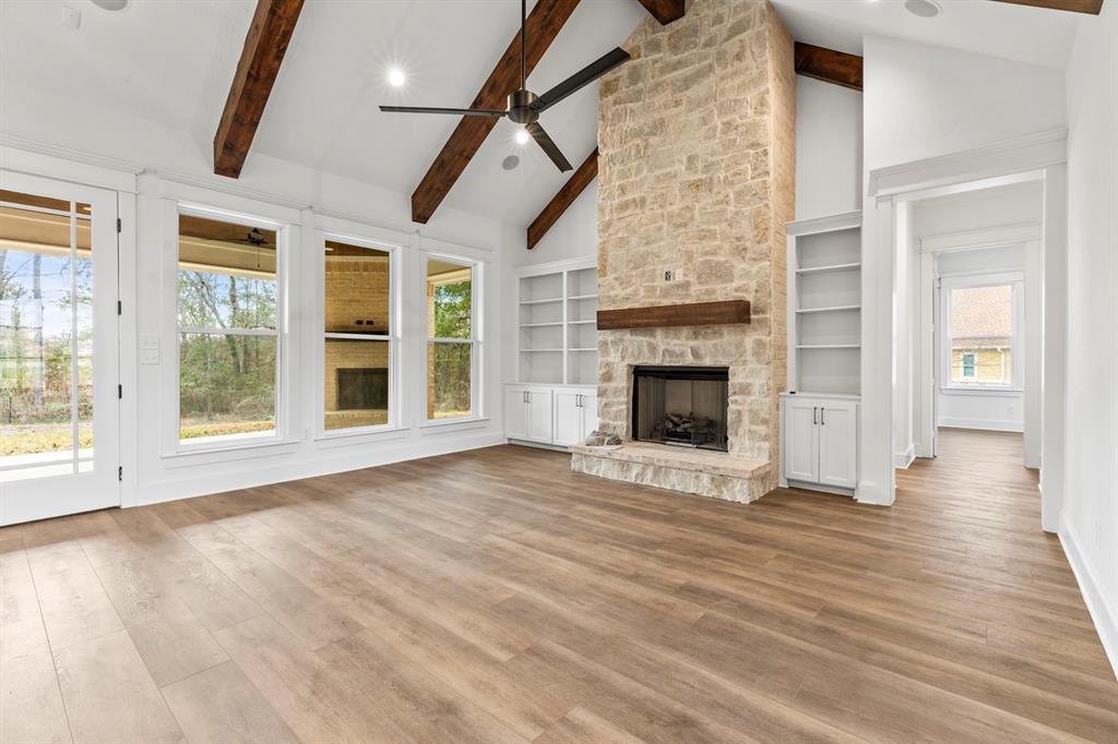 12171 Copper Court Tyler, TX 75706 - Photo 12 of 40 a view of an empty room with wooden floor and a window