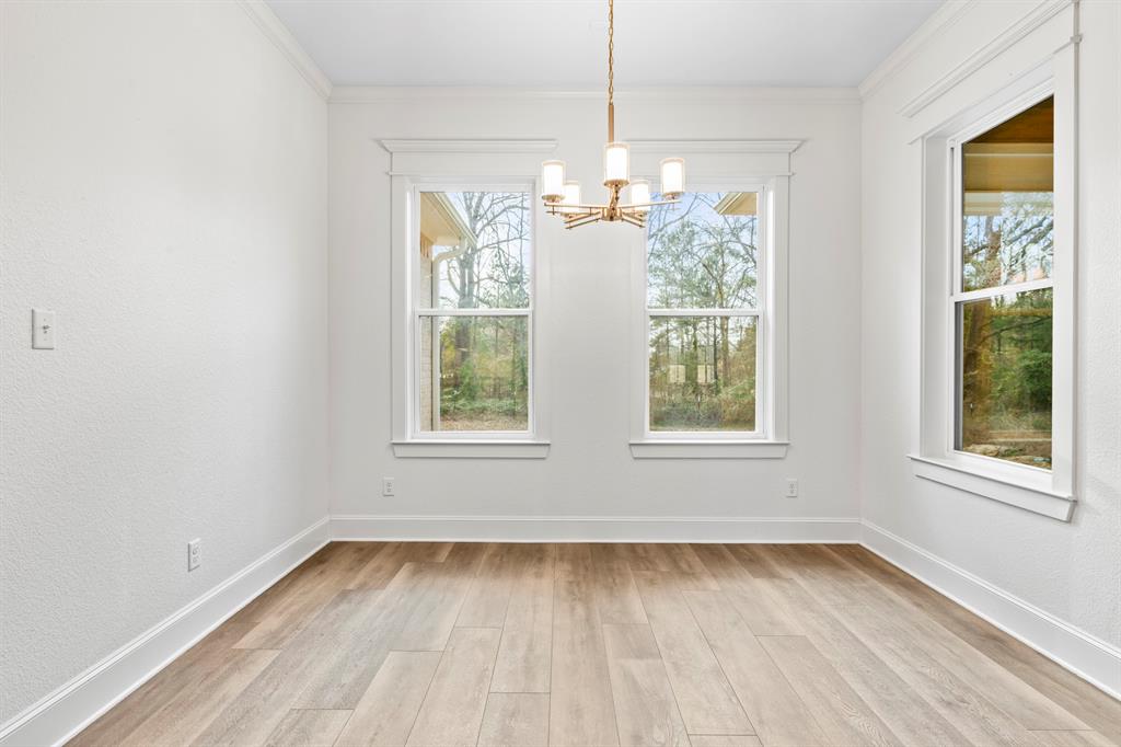 12171 Copper Court Tyler, TX 75706 - Photo 19 of 40 an empty room with wooden floor and windows