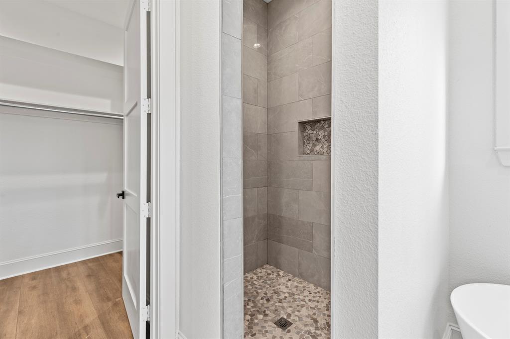 12171 Copper Court Tyler, TX 75706 - Photo 24 of 40 a bathroom with a shower