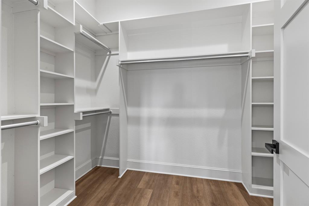 12171 Copper Court Tyler, TX 75706 - Photo 25 of 40 a view of walk in closet with empty racks