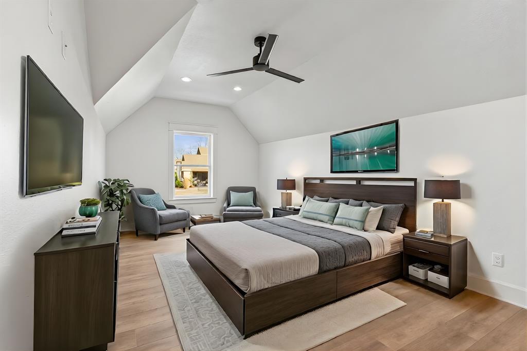 12171 Copper Court Tyler, TX 75706 - Photo 27 of 40 a bedroom with bed and a flat tv screen on dresser