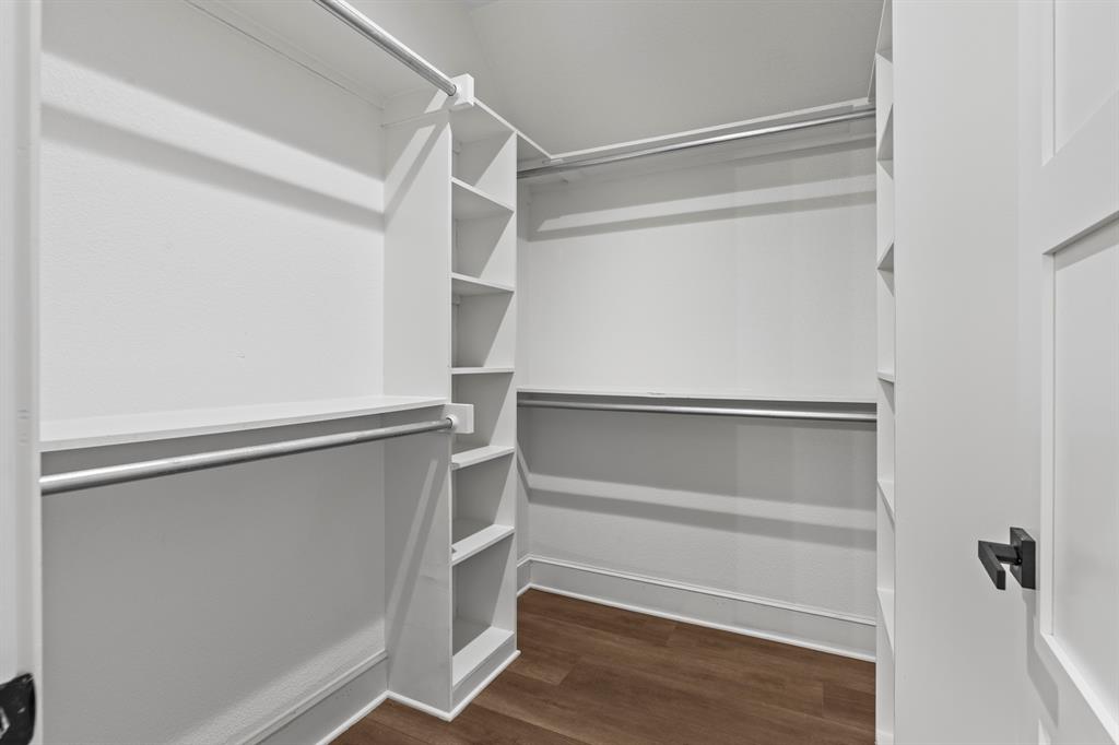 12171 Copper Court Tyler, TX 75706 - Photo 29 of 40 a view of walk in closet with empty racks