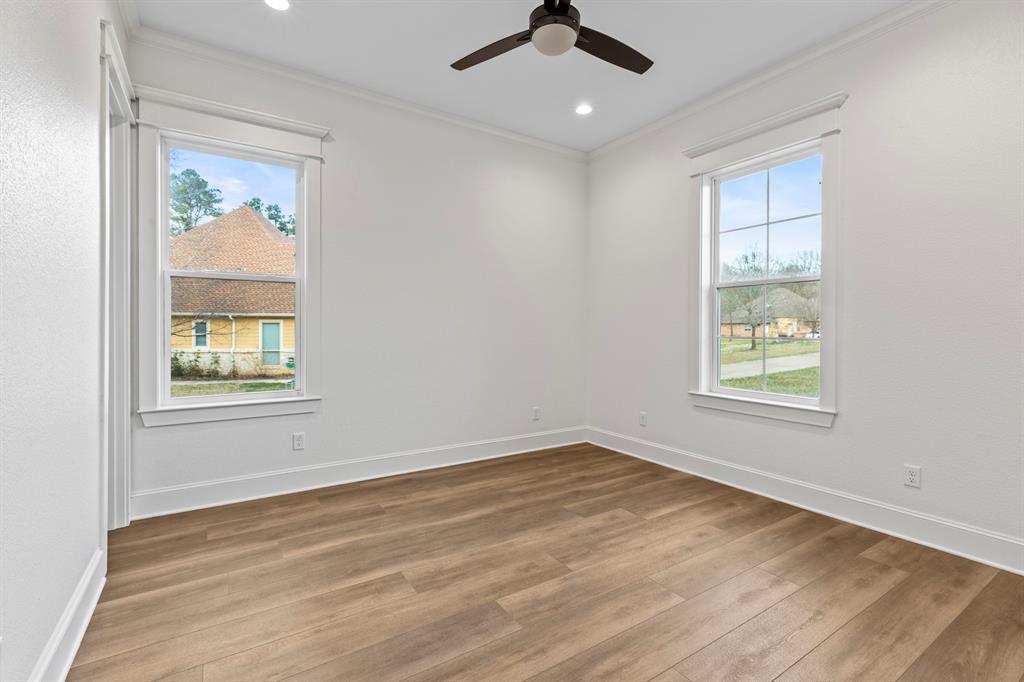12171 Copper Court Tyler, TX 75706 - Photo 34 of 40 a view of an empty room with a window and wooden floor
