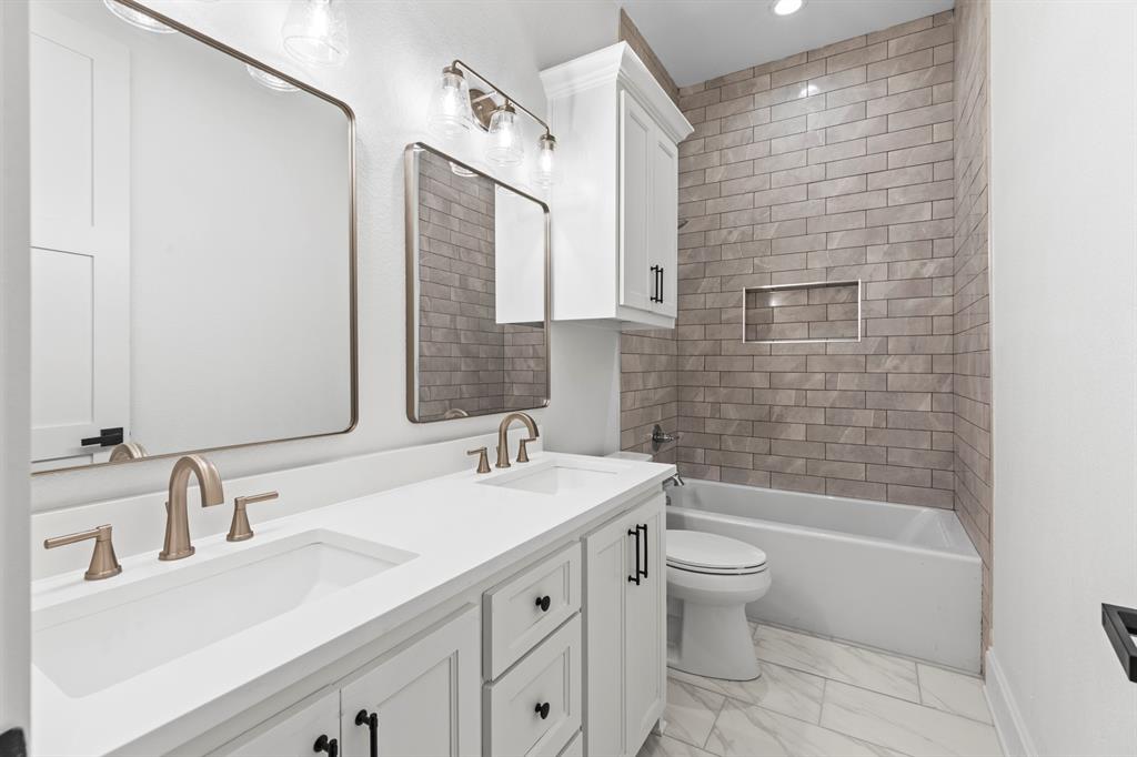 12171 Copper Court Tyler, TX 75706 - Photo 35 of 40 a bathroom with a sink a toilet and shower