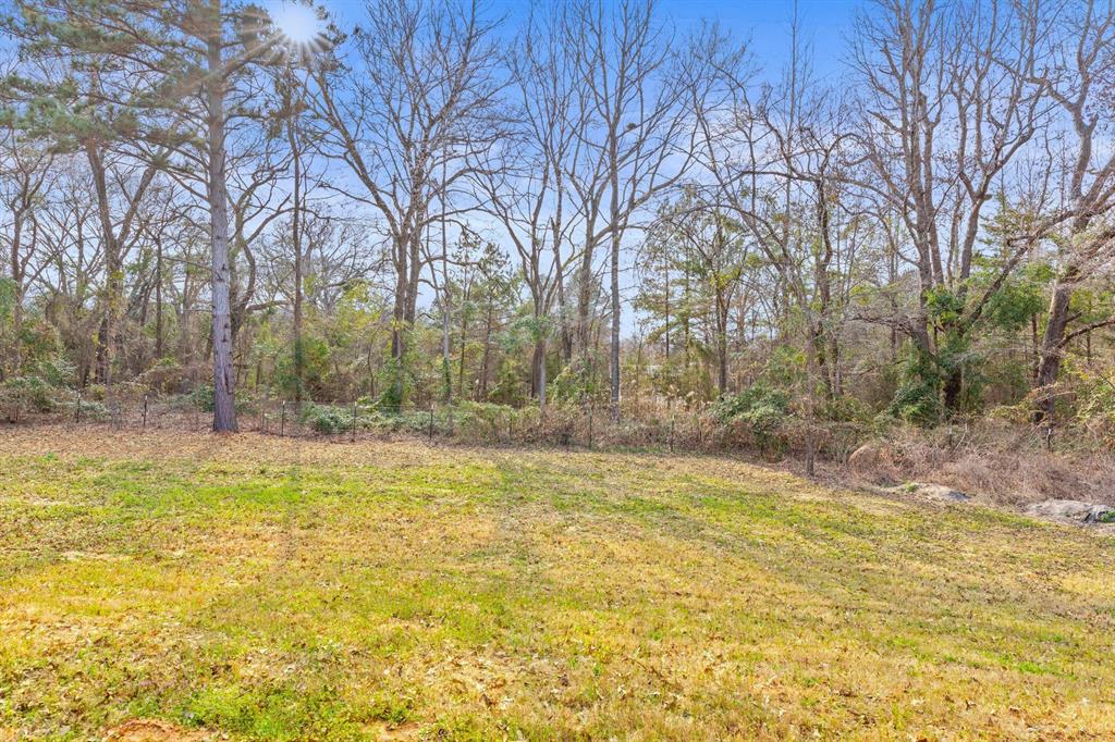 12171 Copper Court Tyler, TX 75706 - Photo 5 of 40 a view of a swimming pool with an outdoor space and seating area