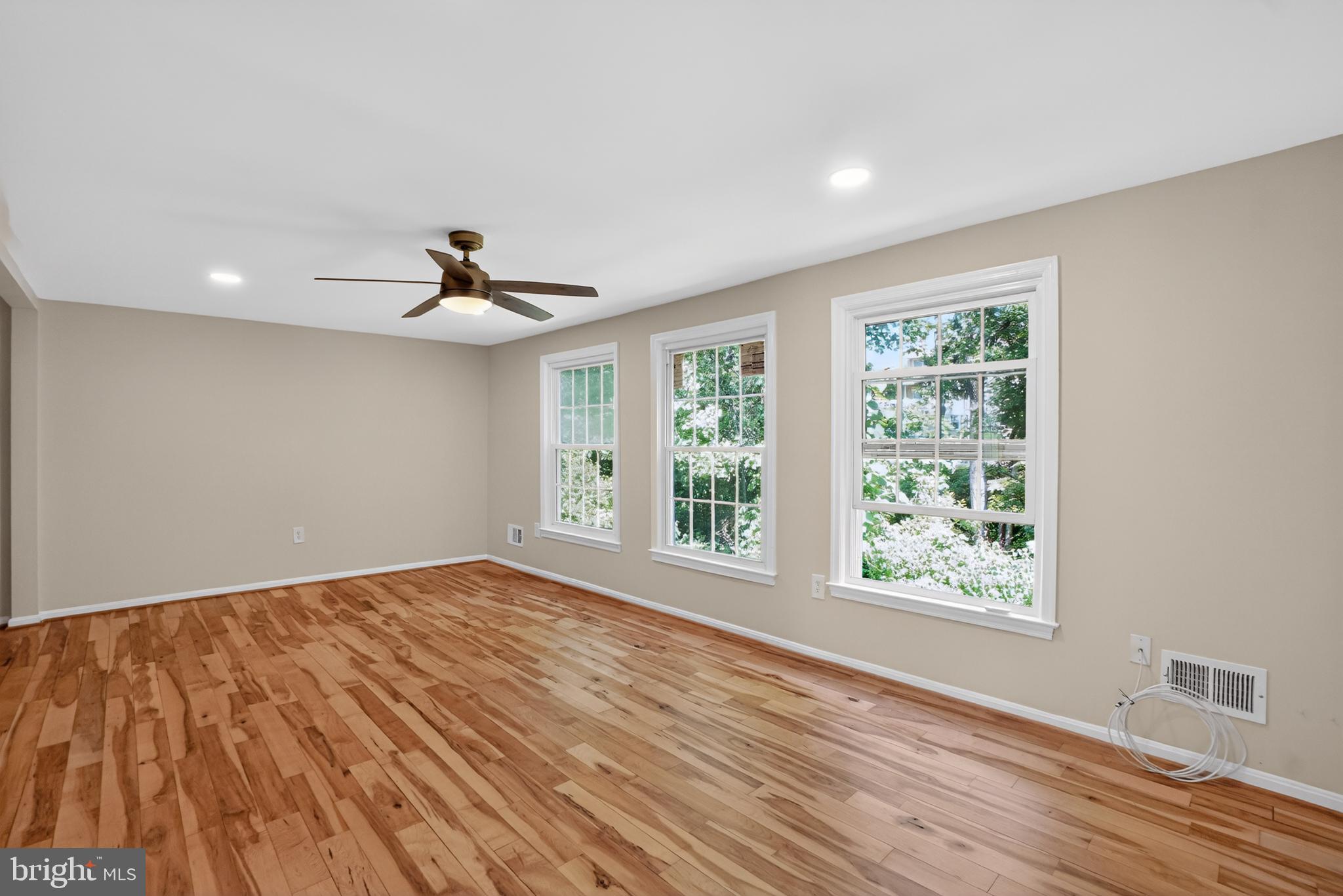 1232 Palmer Road, Unit 111 Fort Washington, MD 20744 - Photo 17 of 45 a view of an empty room with wooden floor and a window