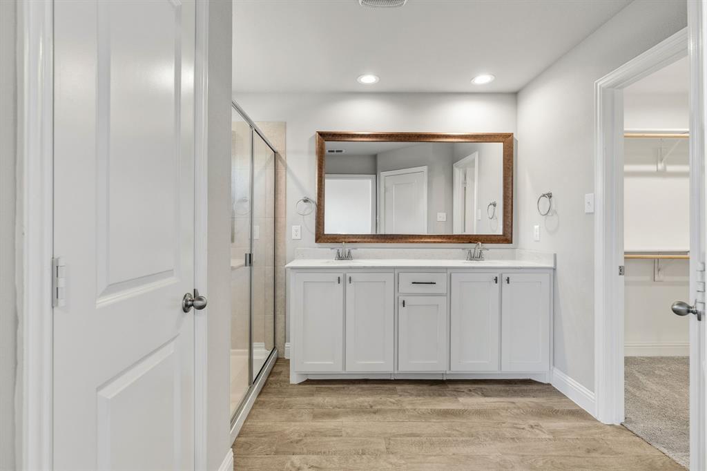 915 Timber Ridge Drive Justin, TX 76247 - Photo 21 of 39 Dual vanity with a white countertop and rectangular sinks