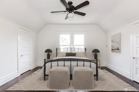 a view of a livingroom with a table and chair