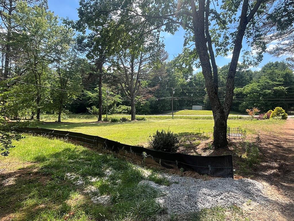 2610 Lower Bethany Road Ball Ground, GA 30107 - Photo 75 of 76 a view of a swimming pool with a yard
