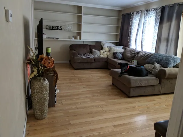 a living room with furniture and a window