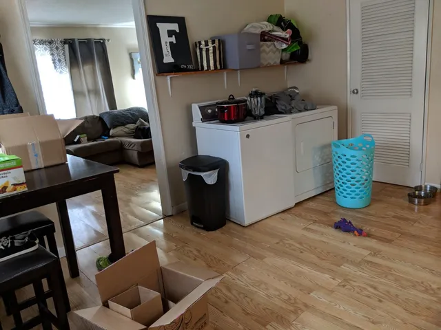 a kitchen with stainless steel appliances granite countertop a sink and a refrigerator