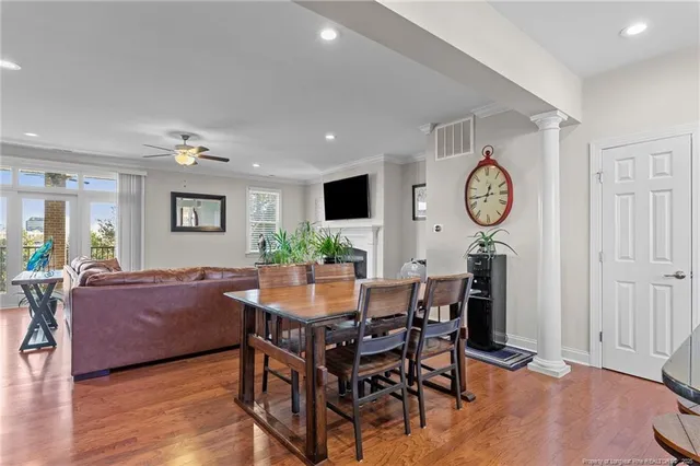 a living room with a fireplace and a flat screen tv