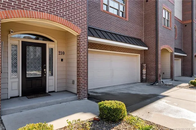 a view of front door of house with stairs