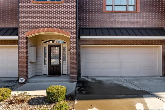 a front view of a house with yard
