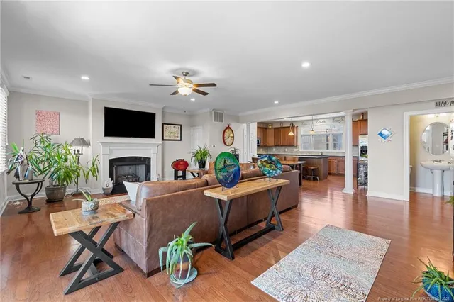 a kitchen with kitchen island a large counter top space appliances and cabinets