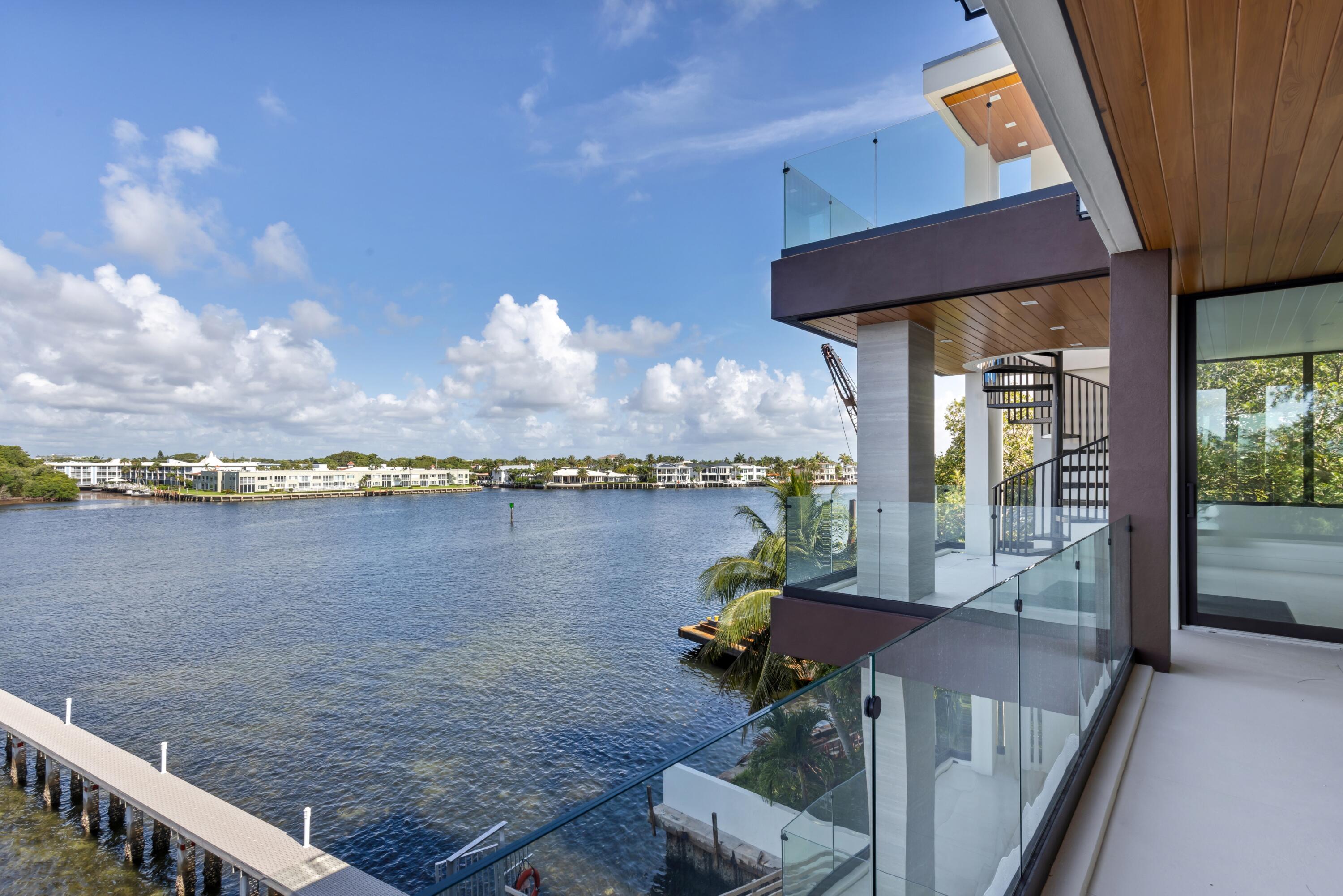 900 Lago Mar Lane, Unit PH Boca Raton, FL 33431 - Photo 47 of 58 a view of a balcony with chair and table