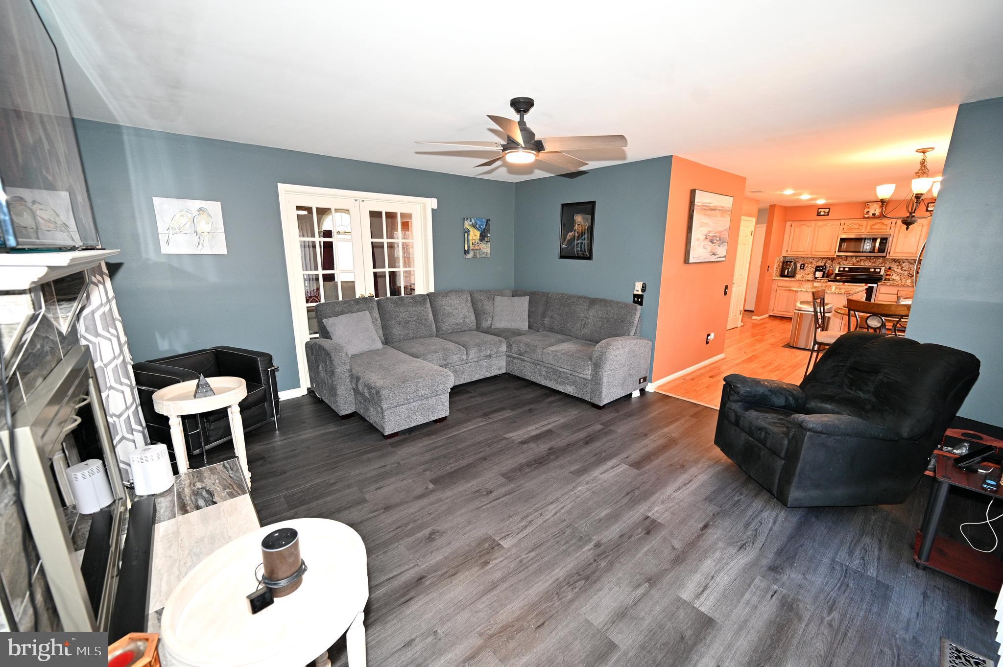 7729 Castle Rock Drive Clinton, MD 20735 - Photo 15 of 65 a living room with furniture and wooden floor