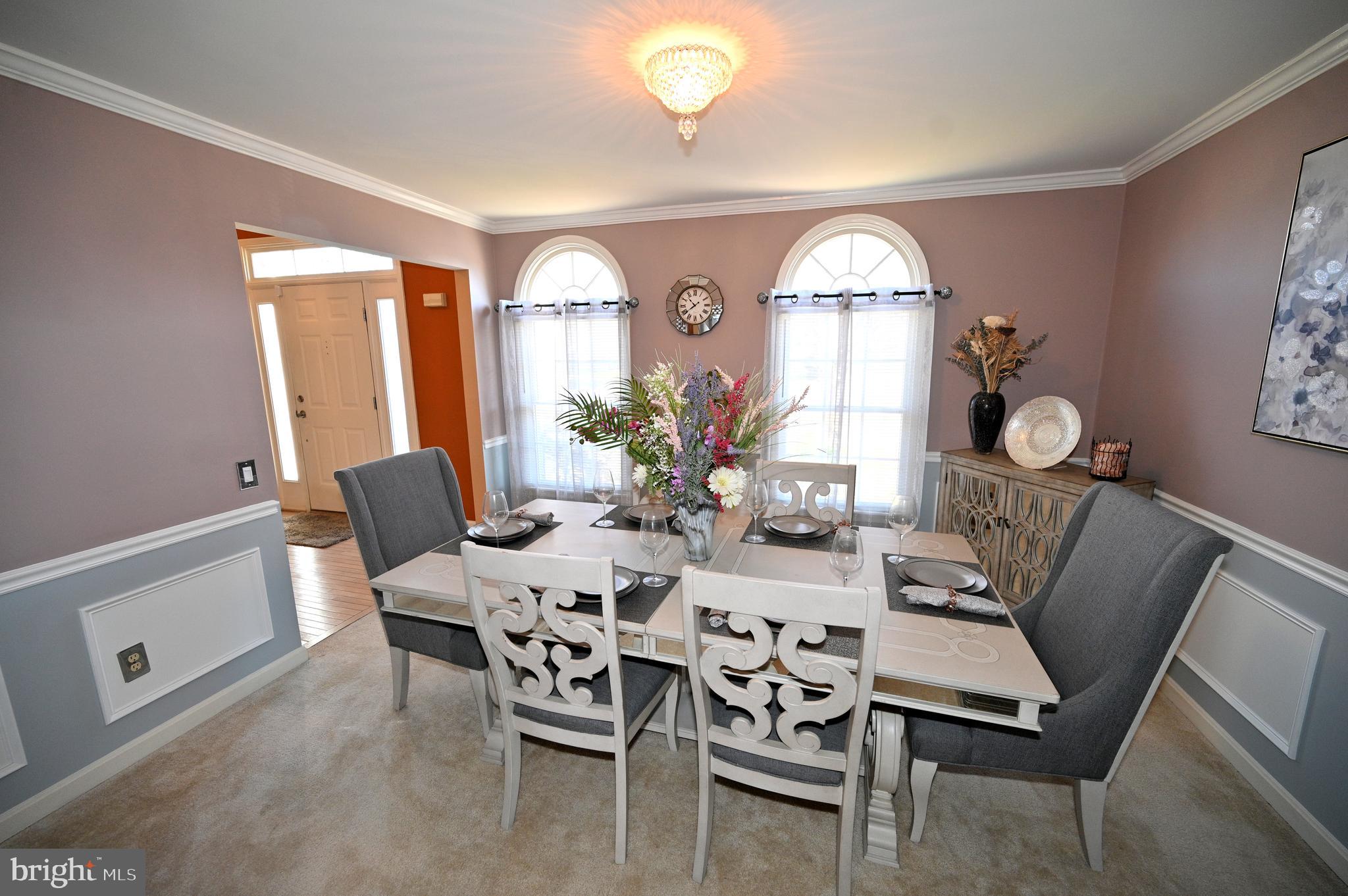 7729 Castle Rock Drive Clinton, MD 20735 - Photo 18 of 65 a view of a dining room with furniture and chandelier