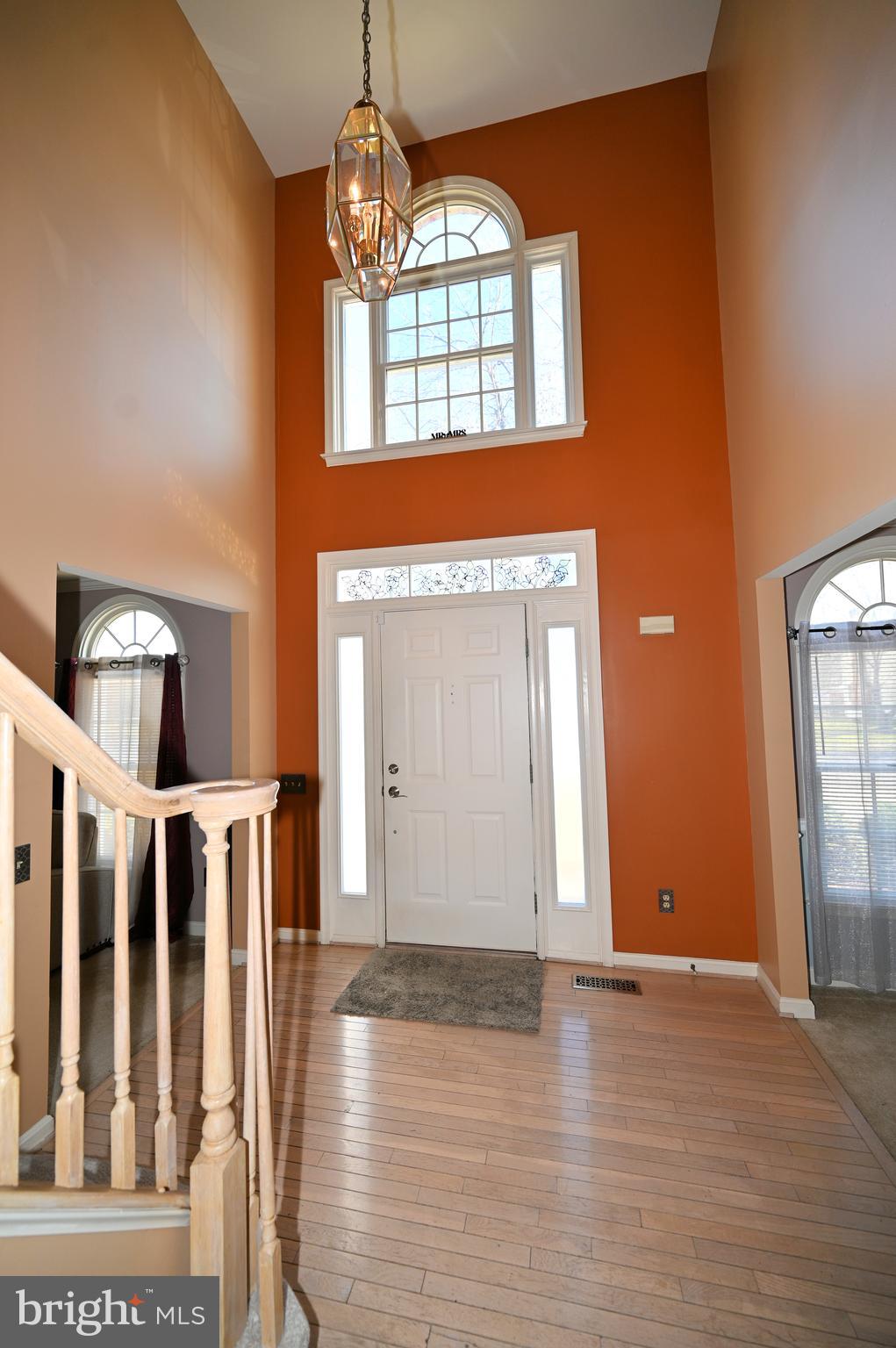 7729 Castle Rock Drive Clinton, MD 20735 - Photo 2 of 65 a view of a livingroom with wooden floor and staircase