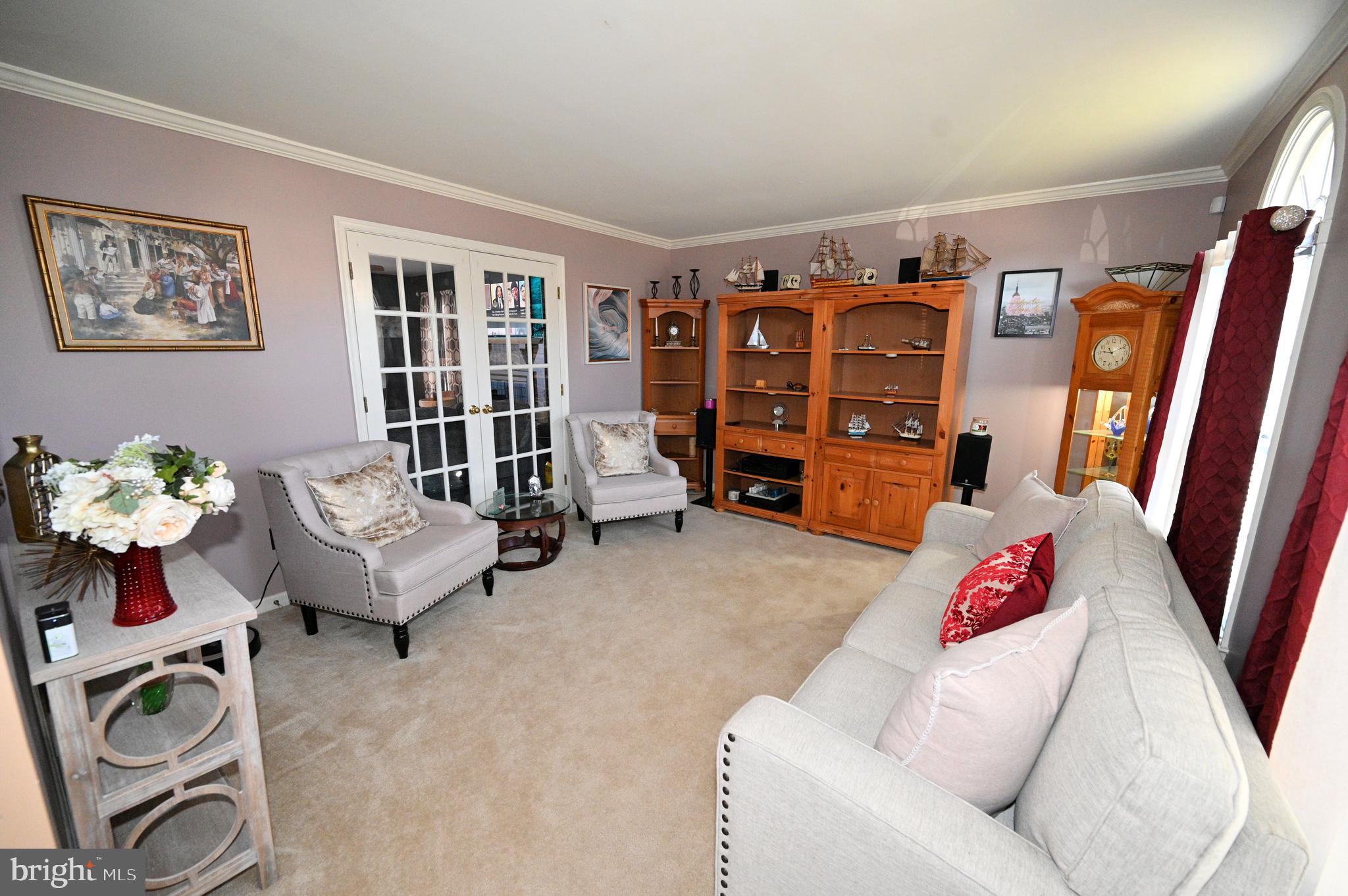 7729 Castle Rock Drive Clinton, MD 20735 - Photo 21 of 65 a living room with furniture and flowers