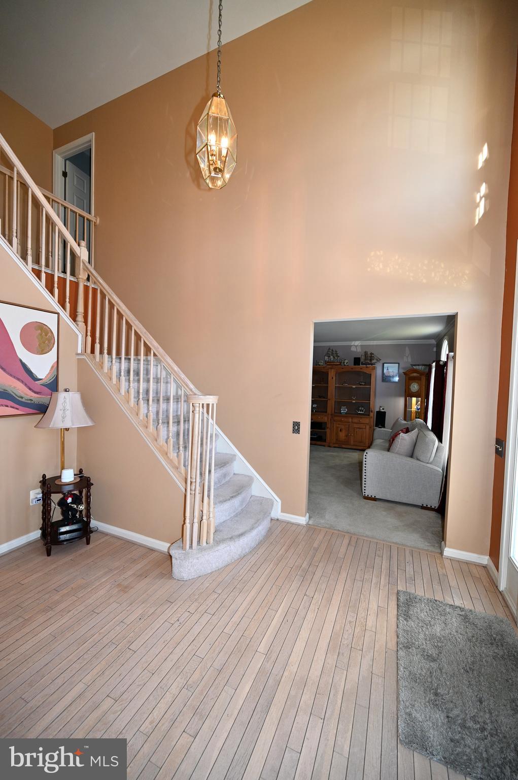 7729 Castle Rock Drive Clinton, MD 20735 - Photo 3 of 65 a view of a livingroom with wooden floor and furniture