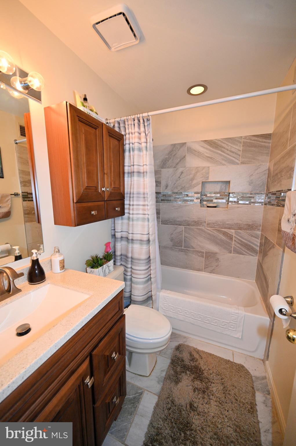 7729 Castle Rock Drive Clinton, MD 20735 - Photo 40 of 65 a bathroom with a sink a toilet and shower