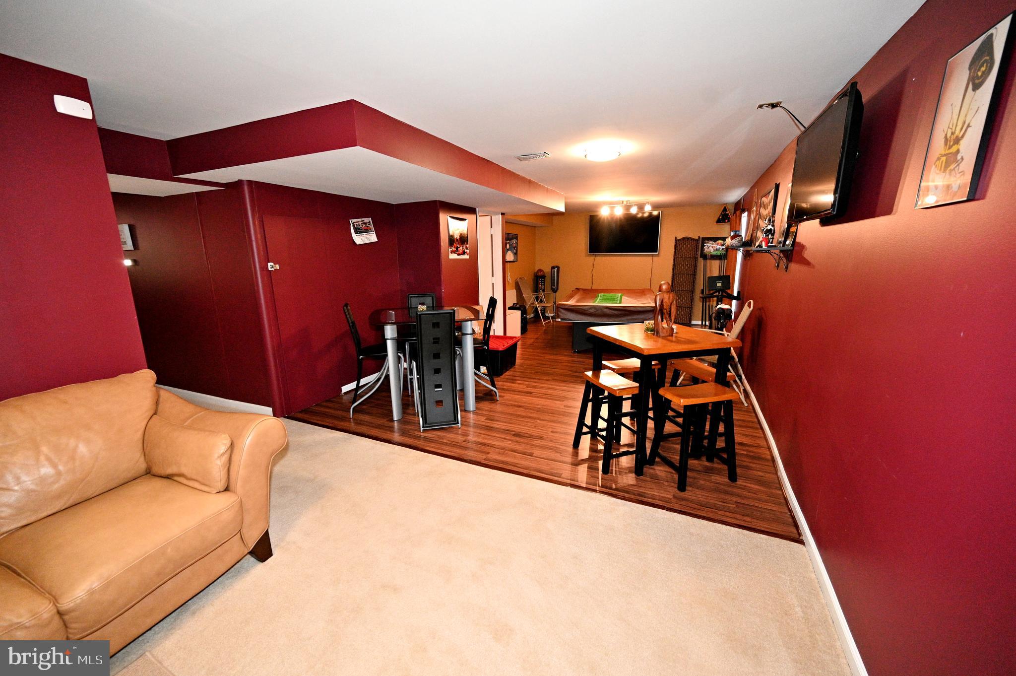 7729 Castle Rock Drive Clinton, MD 20735 - Photo 44 of 65 a dining room with furniture and wooden floor