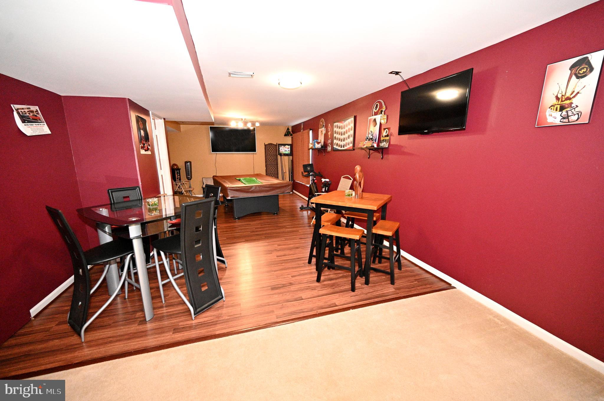 7729 Castle Rock Drive Clinton, MD 20735 - Photo 46 of 65 a dining room with furniture and wooden floor