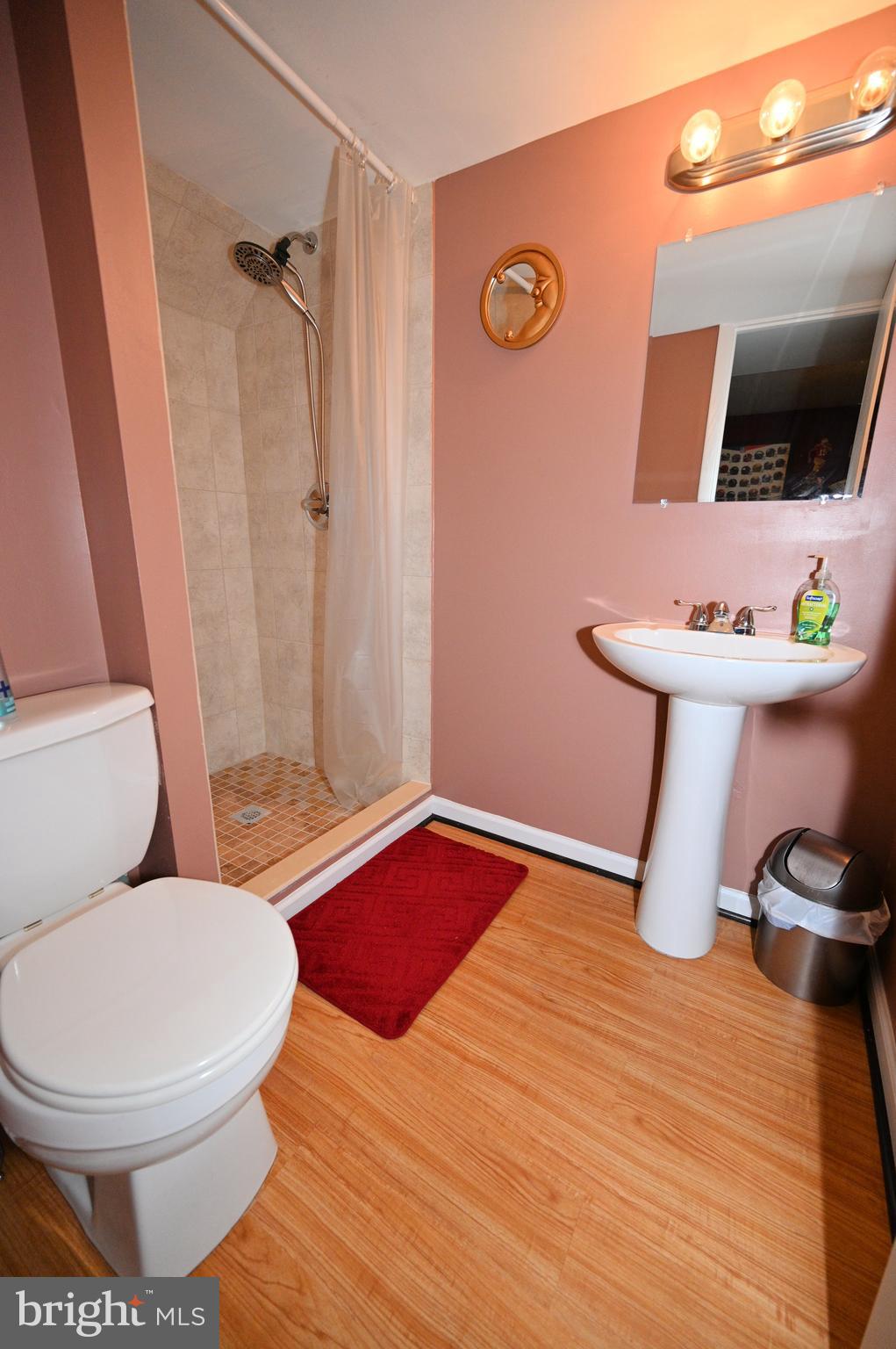 7729 Castle Rock Drive Clinton, MD 20735 - Photo 54 of 65 a bathroom with a toilet and a shower