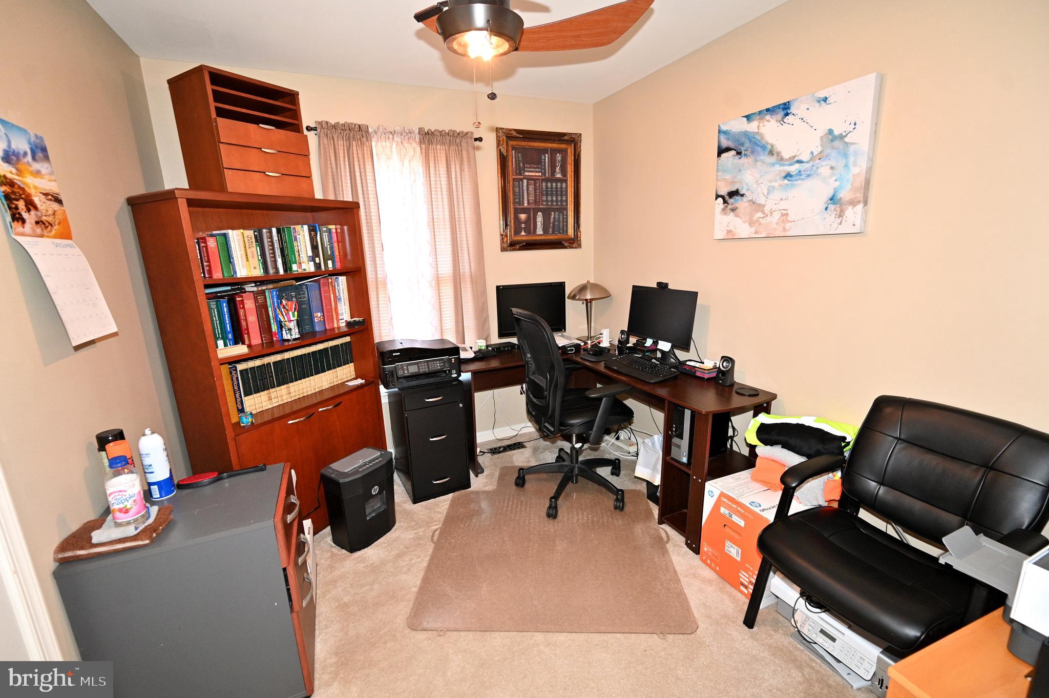 7729 Castle Rock Drive Clinton, MD 20735 - Photo 56 of 65 a view of a workspace with furniture and a window