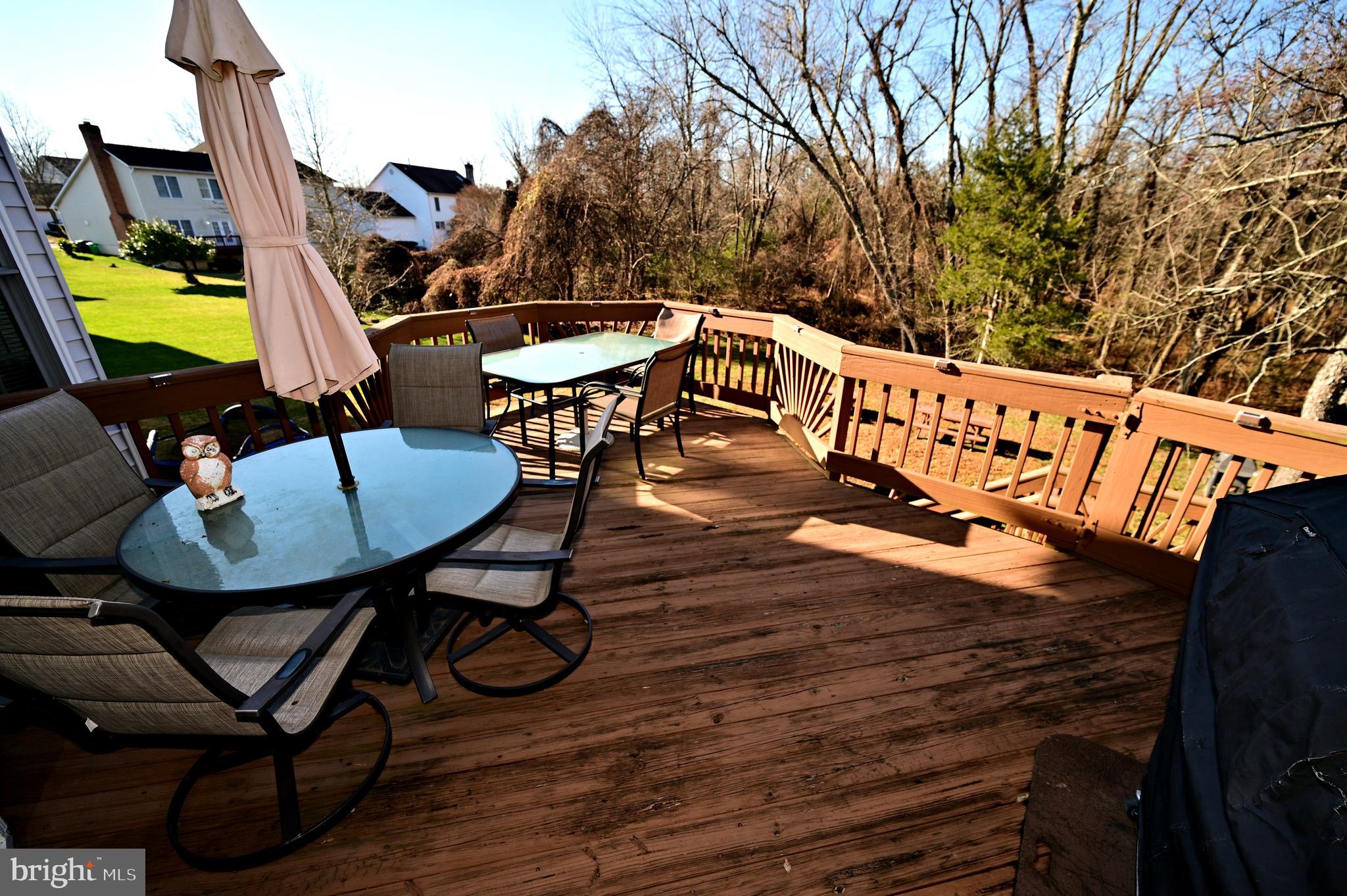 7729 Castle Rock Drive Clinton, MD 20735 - Photo 60 of 65 a view of a chairs and table on the wooden floor