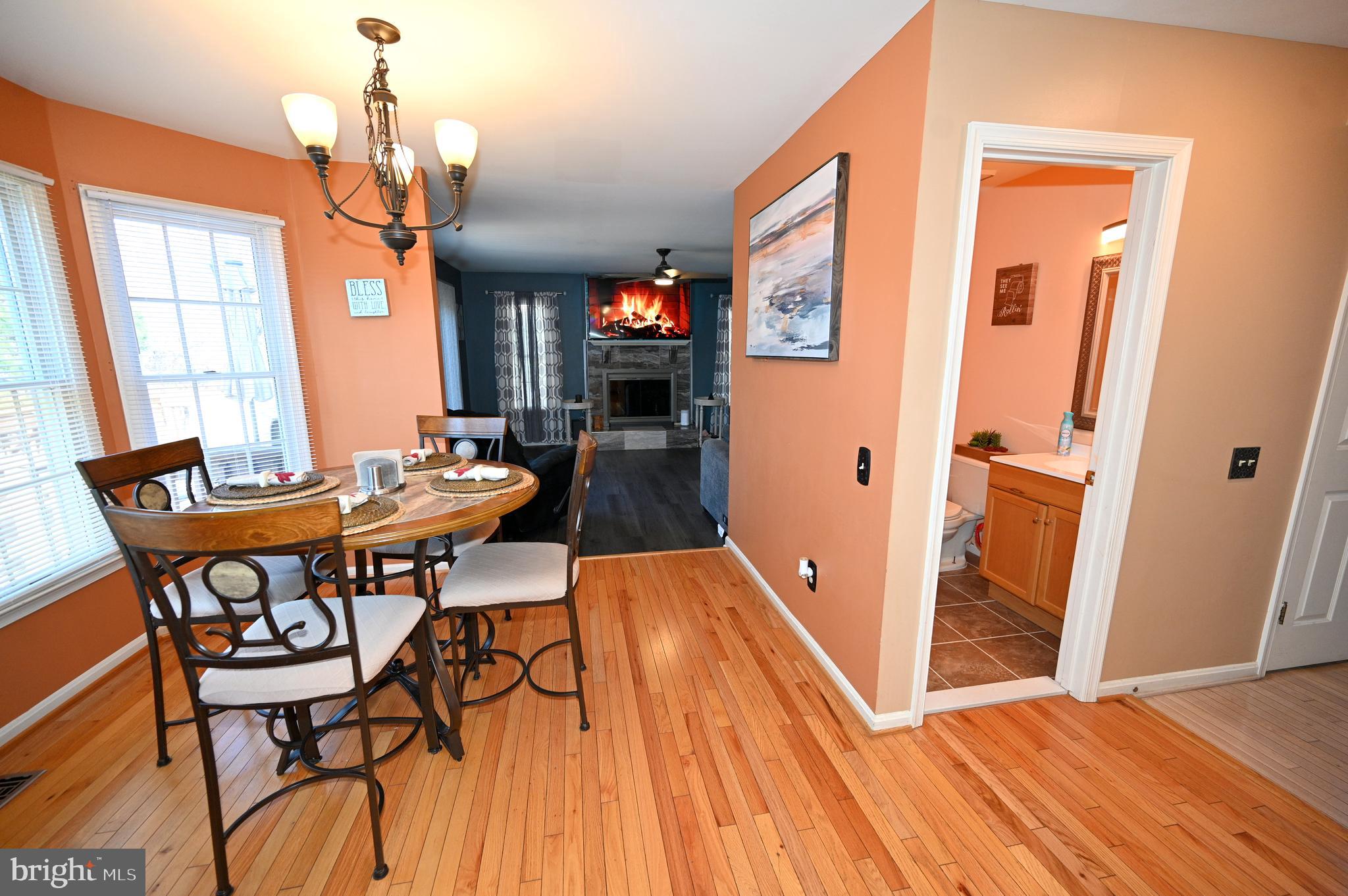 7729 Castle Rock Drive Clinton, MD 20735 - Photo 8 of 65 a dining room with furniture and wooden floor