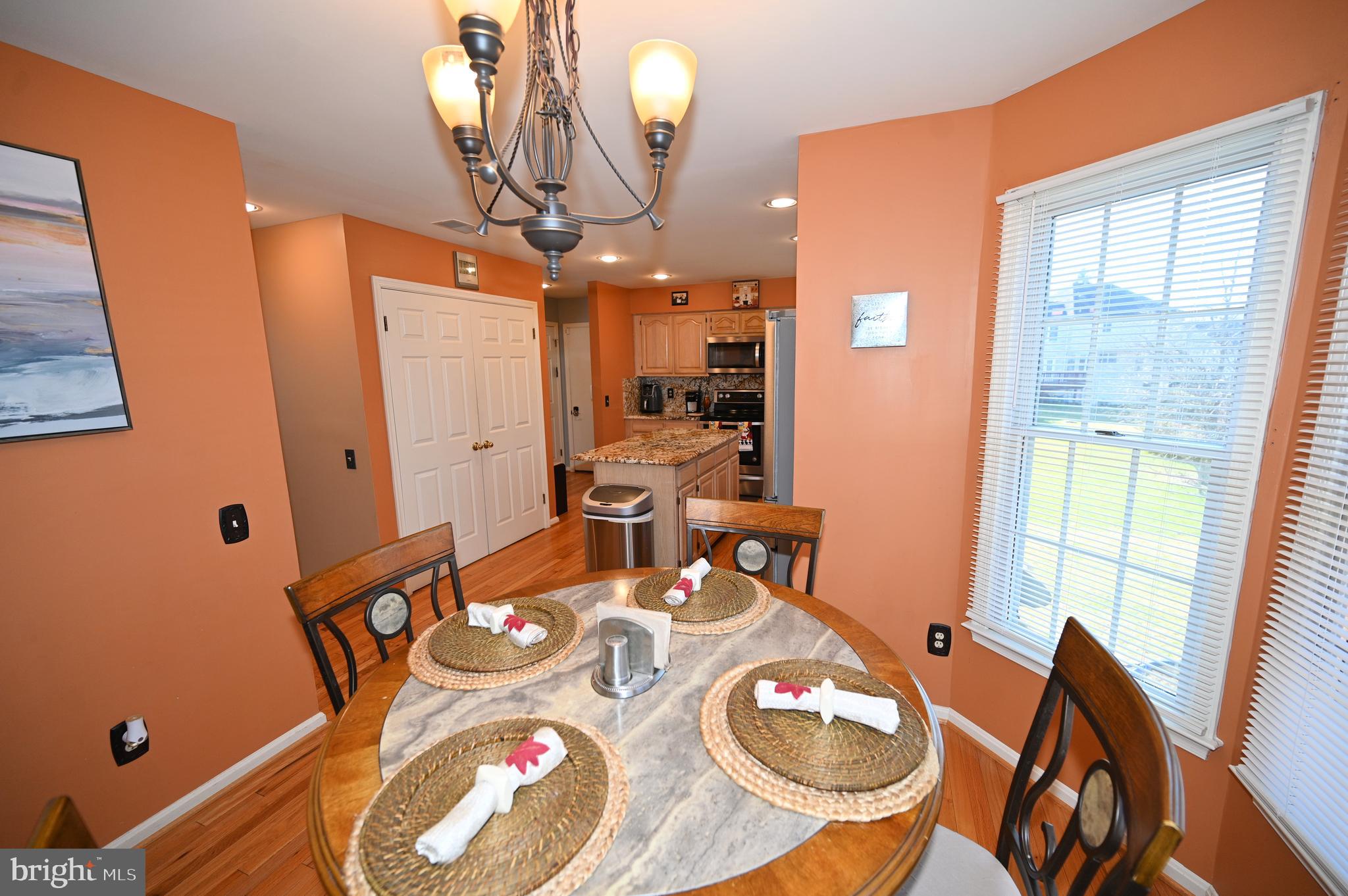 7729 Castle Rock Drive Clinton, MD 20735 - Photo 9 of 65 a dining room with furniture and wooden floor