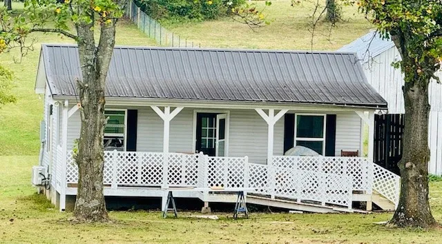 a view of a house with a wooden deck