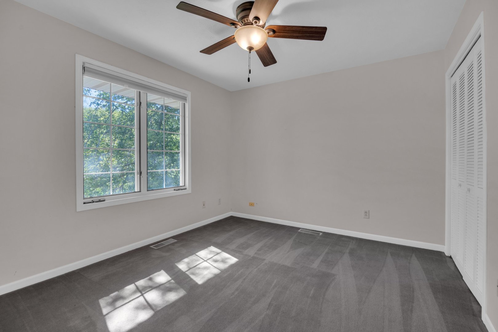 112 Sequoyah Court Southwest Poplar Grove, IL 61065 - Photo 19 of 26 a view of empty room with wooden floor and fan