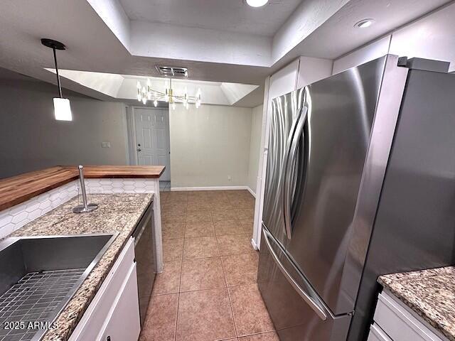 2935 North 68th Street, Unit 127 Scottsdale, AZ 85251 - Photo 2 of 25 a kitchen with stainless steel appliances granite countertop a refrigerator and a sink