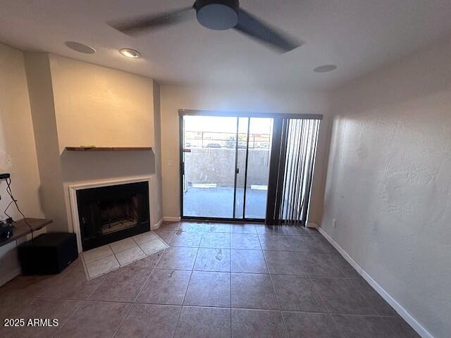 2935 North 68th Street, Unit 127 Scottsdale, AZ 85251 - Photo 9 of 25 a view of an empty room with a fireplace and a window